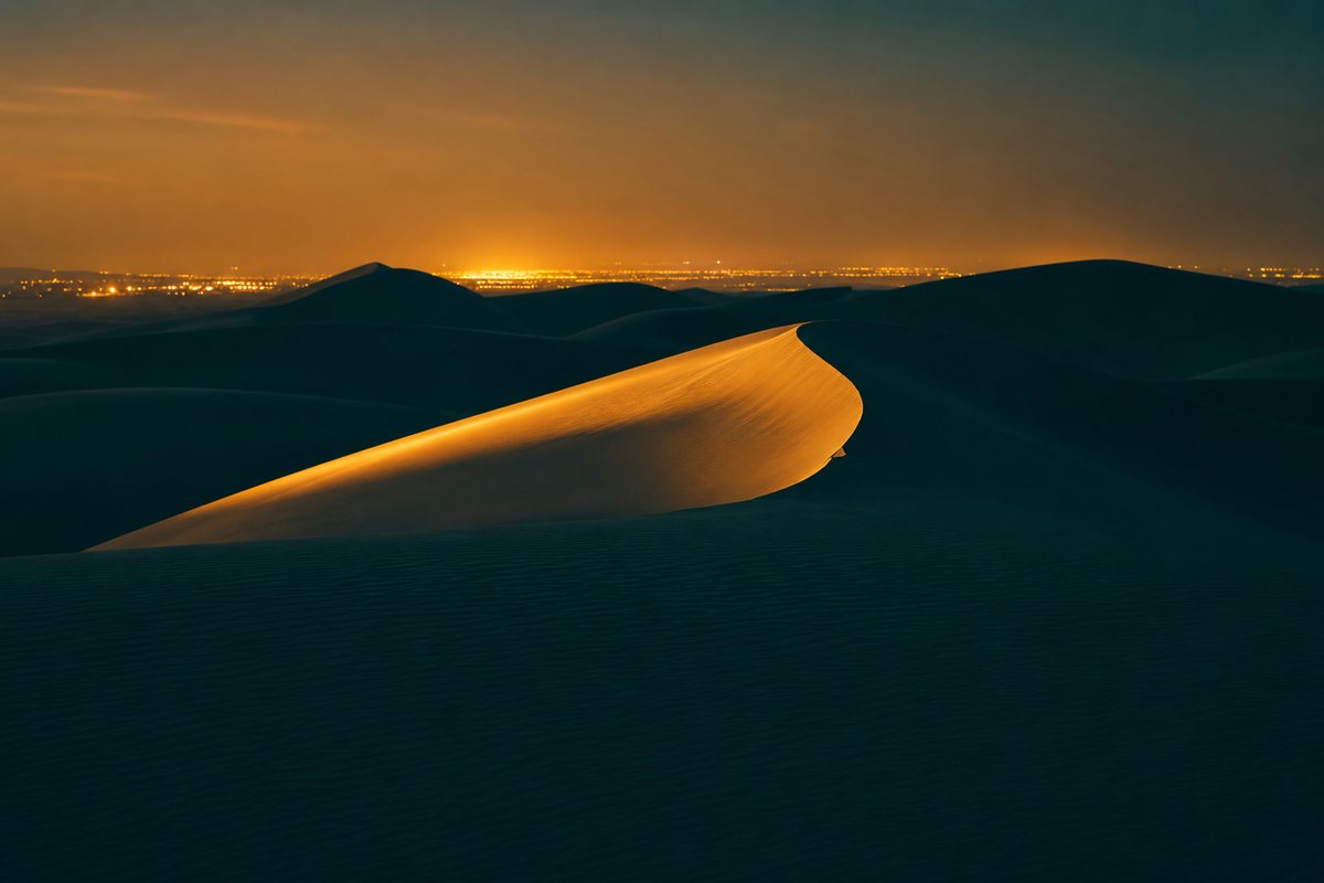 Desert dunes at dusk on the GCC export corridor