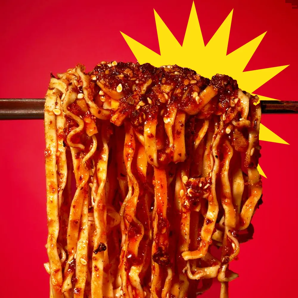 MasterChow noodles lifted in a red splash